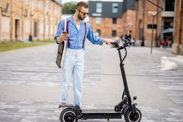 Stylish Guy Going Drive Electric Scooter Solar Panel His Bag Rechtenvrije Stockafbeeldingen