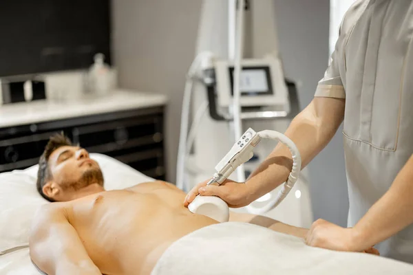 Man Receiving Vacuum Roller Massage Belly Arrea Medical Beauty Centre – stockfoto