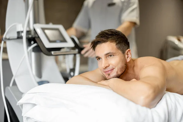 Portrait Happy Man Lying Medical Couch Vacuum Roller Massage Procedure — Stockfoto
