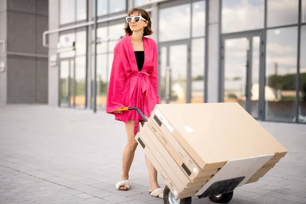 Woman Carries Furniture Boxes Cart Delivering Them Home Process Self — Foto Stock