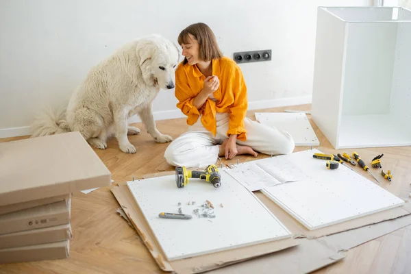 Young Woman Assembles Furniture Herself Sitting Having Fun Her Cute — Stockfoto