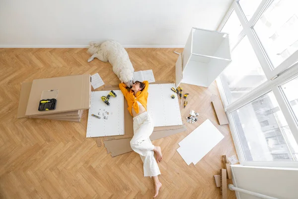 Young Woman Lies Floor Her Cute Dog Resting While Making — Stock Fotó