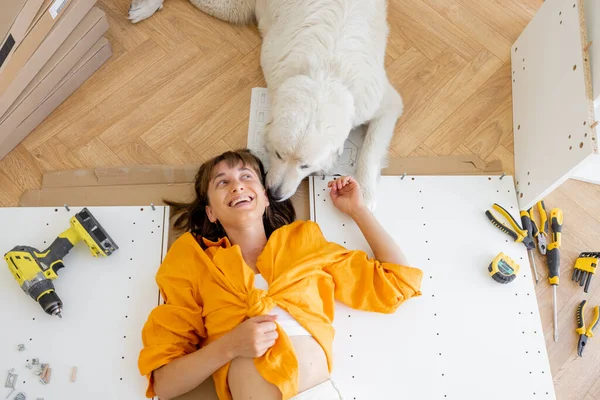 Young Happy Woman Lies Floor Her Cute Dog Resting While – stockfoto