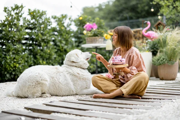 Cheerful Woman Playing Her Adorable White Dog While Sitting Festive — ストック写真