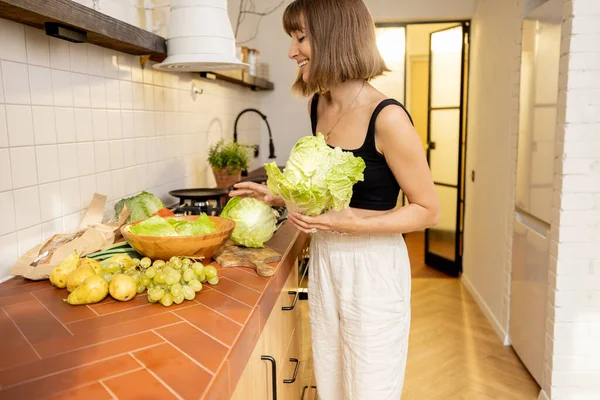 Young Woman Cooks Healthy Vegetarian Food Green Fresh Ingredients Kitchen — 图库照片