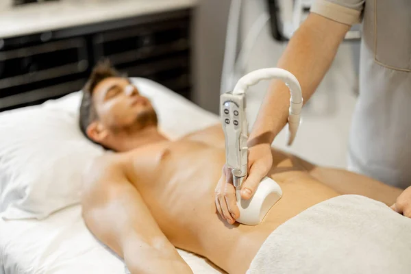 Man Receiving Vacuum Roller Massage Belly Arrea Medical Beauty Centre – stockfoto