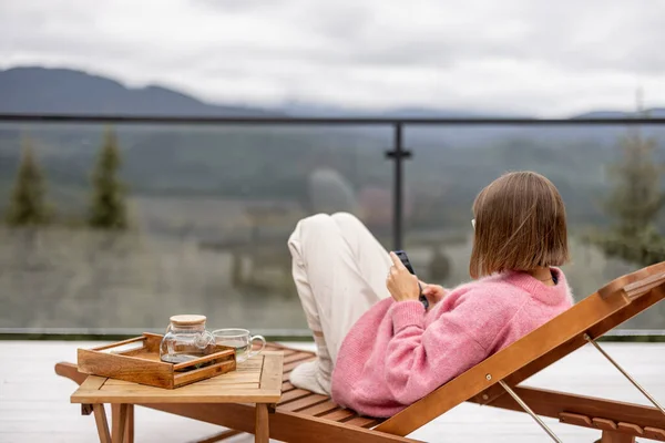Woman Pink Sweater Rests Spacious White Terrace Mountains Recreation House — Stock Photo, Image