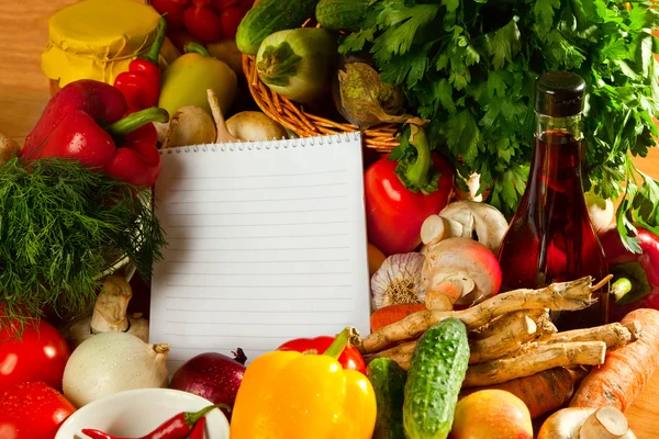 Notebook paper to write recipes and vegetables — Stock Photo, Image