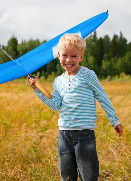 Boy play with airplane — Stock Photo, Image