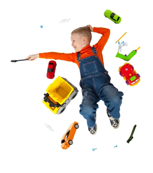 Little boy repairs toy car — Stock Photo, Image