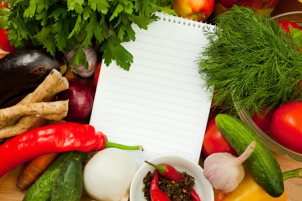 Notebook paper to write recipes and vegetables — Stock Photo, Image