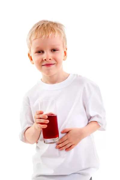 Garotinho com um copo de suco — Fotografia de Stock