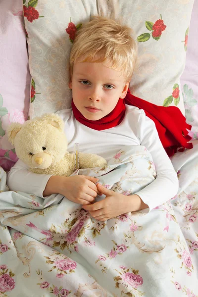 Sick boy is in bed — Stock Photo, Image