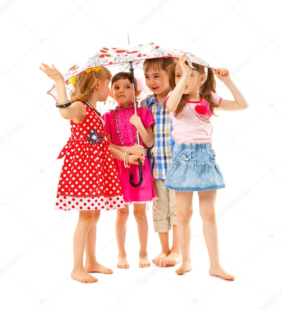 Barefoot children under an umbrella