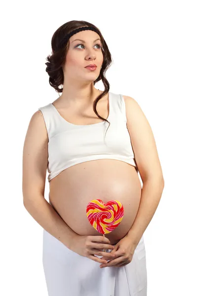 Pregnant woman and a lollipop — Stock Photo, Image