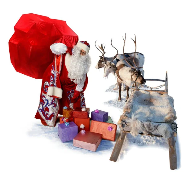 Santa Claus with big bag of gifts and his reindeer sleigh — Stock Photo, Image