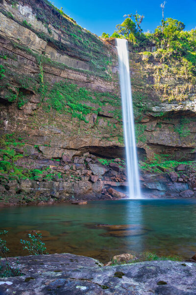 waterfall falling streams from mountain top with reflection from different perspective image taken on phe phe fall meghalaya india. it is one of the tallest waterfall of meghalaya.