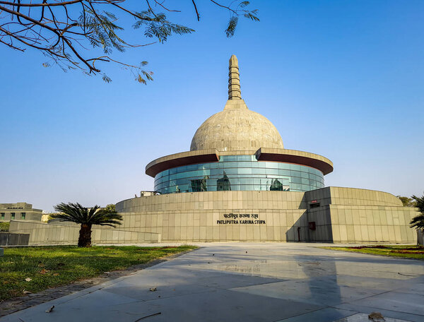 buddha stupa with bright blue sky at morning from low angle image is taken at buddha park patna bihar india on Apr 15 2022.