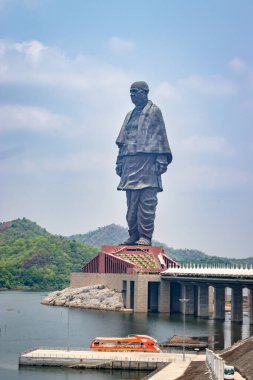 statue of unity the world tallest statue with bright dramatic sky at day from different angle image is taken at vadodra gujrat india on July 10 2022. clipart