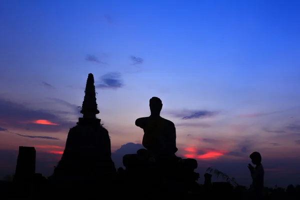 Silhouette of buddha and stupa — Stock Photo, Image