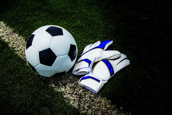 Soccer ball and gloves — Stock Photo, Image