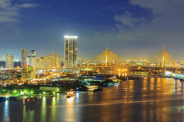 Modern building at riverside in twilight scene [Bangkok, Thailand] — стоковое фото