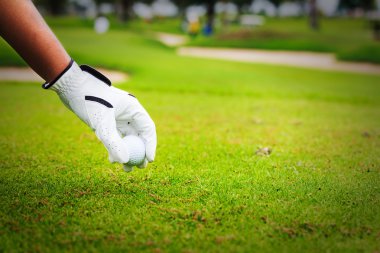 elini tutmak golf topu