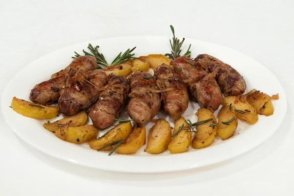 Meat sausages with baked apples and rosemary — Stock Photo, Image