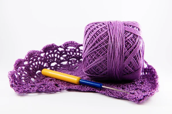Skein of cotton thread and an openwork pattern,  crocheted Fotografie de stoc