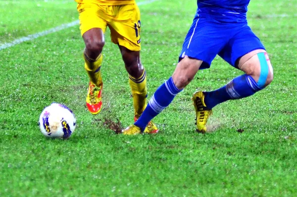 Jogador de futebol perna em ação — Fotografia de Stock