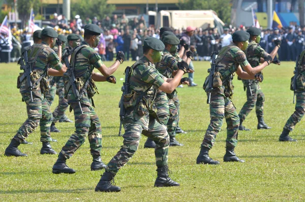 KUANTAN, MALAYSIA - AUG 31: Malaysia Army demonstrate a hand combat defending at National Day parade, celebrating the 55th anniversary of independence on August 31, 2012 in Kuantan, Pahang, Malaysia.