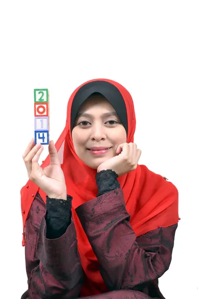 Beautiful young Asian muslim woman happy celebrate New Year 2014 isolated on white background — Stock Photo, Image