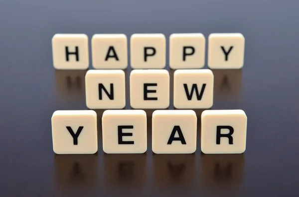 Mutlu yeni yıl word mektup parçaları tarafından oluşturulmuş — Stok fotoğraf