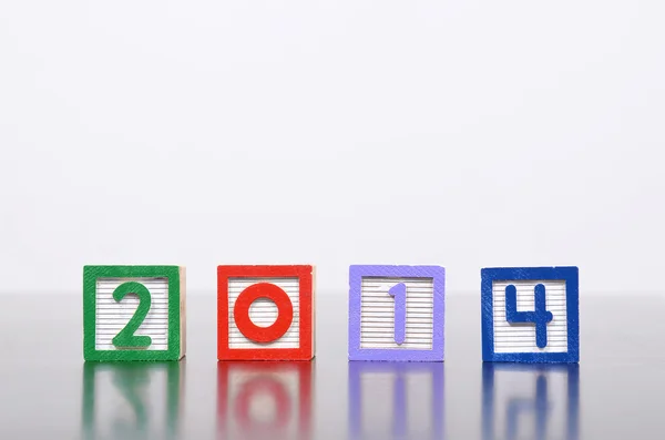 New Year 2014 word formed by wood alphabet blocks — Stock Photo, Image