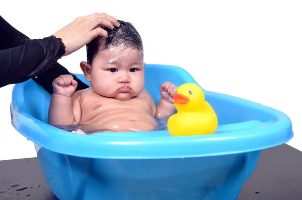 Cute Asian baby enjoying bath by her mother isolated on white background — Stock Photo, Image