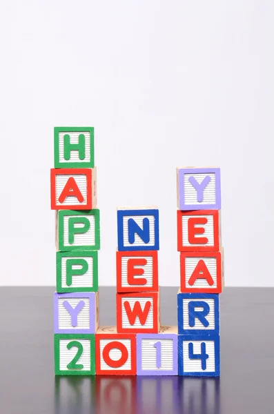 Szczęśliwego nowego roku 2014 słowa tworzą bloki drewna alfabet — Zdjęcie stockowe