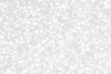 Silvery white abstract background with defocused and blurred circles.
