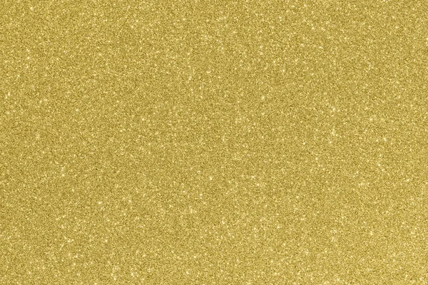 Beautiful glowing gold colored glitter background.