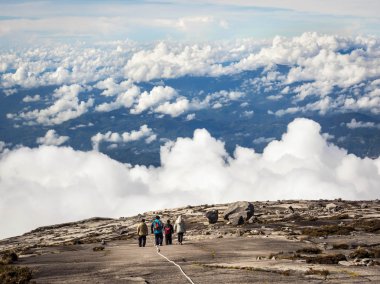 Hikers Walking at the Top of Mount Kinabalu in Sabah, Malaysia clipart