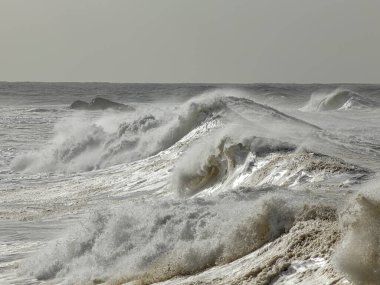 Rough sea day seeing big breaking waves.