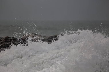 Detailed breaking wave splash. Northern portuguese rocky coast.