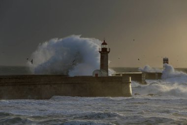 Douro river mouth during a storm at sunset