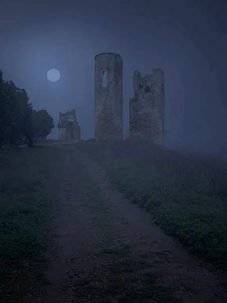 Dark and creepy old war ruin in a mysterious foggy full moon night