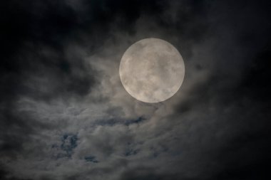 Dark cloudy full moon night background