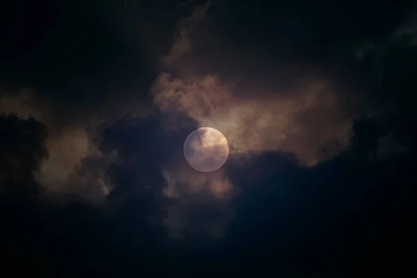 Dark, cloudy ad creepy full moon night