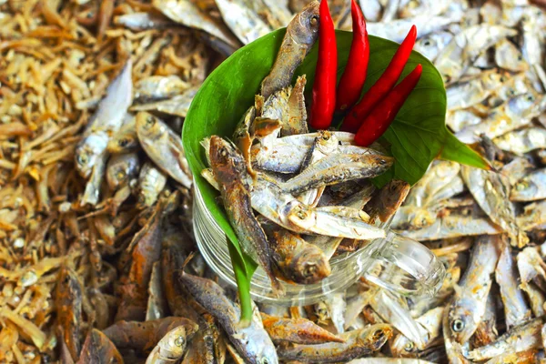 Dry fish in the market and chili red. — Stock Photo, Image