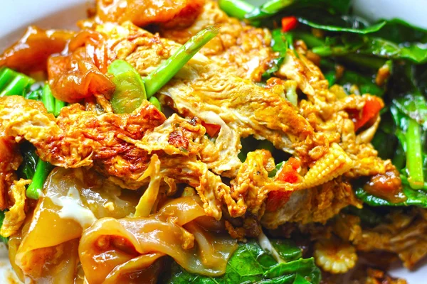 Fried noodles large strip with pork — Stock Photo, Image