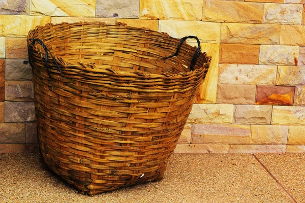 Bamboo trash basket with a stone background. — Stock Photo, Image