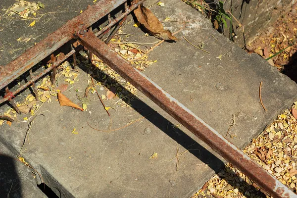 Steel rake on the cement floor. — Stock Photo, Image