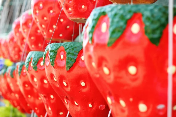 Hanging plant pots - pots strawberry hanging a long way. — Stock Photo, Image